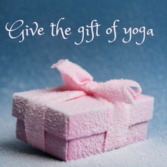 give the gift of yoga image with wrapped present